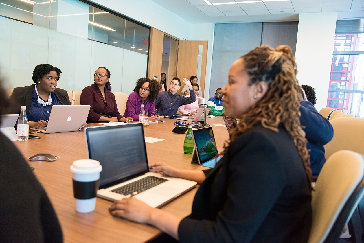 A team discussing a project around a table